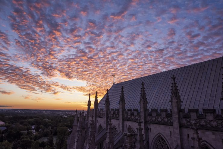Cloudy sky at dawn over the roof of the Cathedral