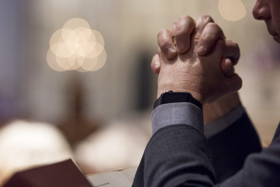 Man praying at the Cathedral