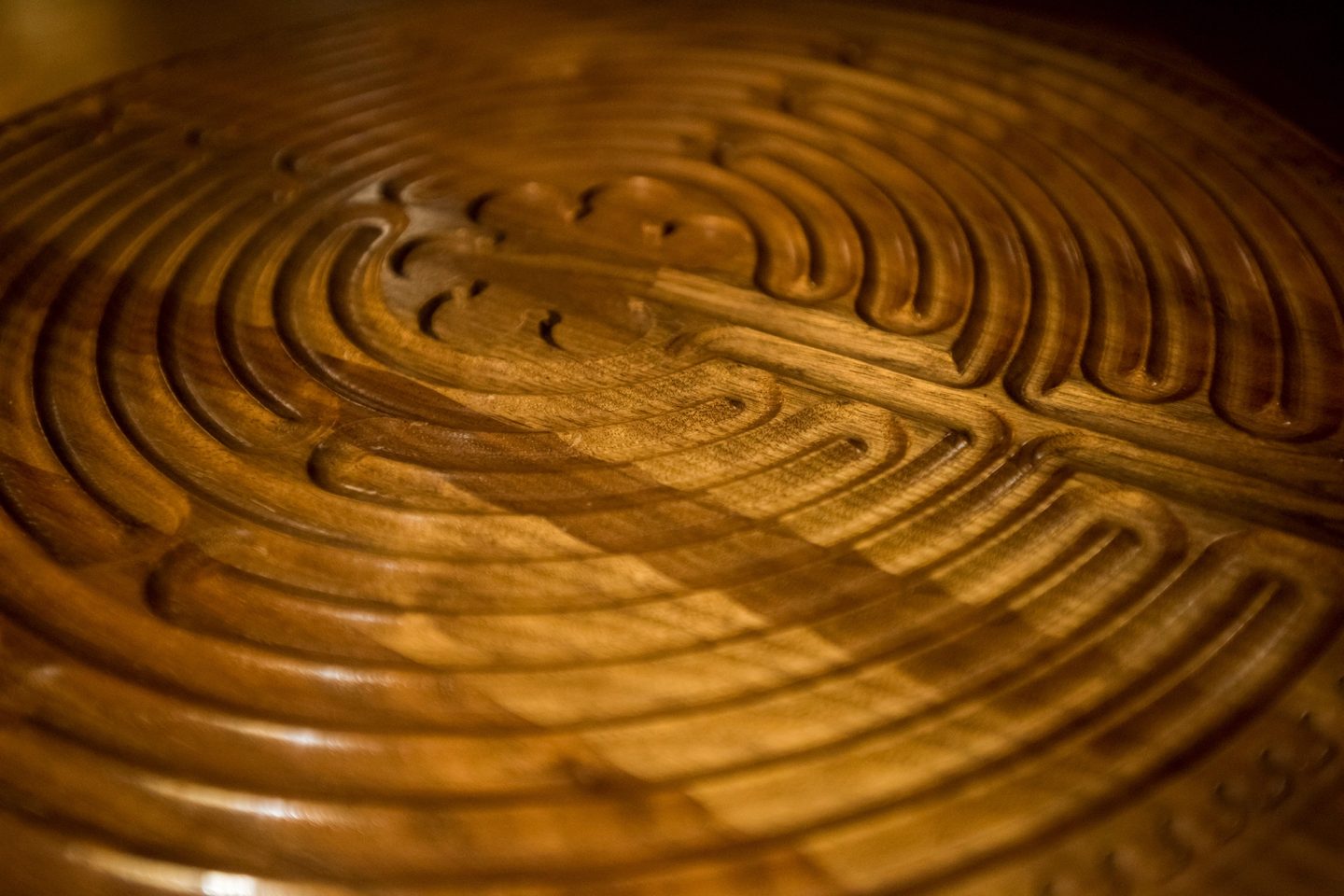 Close-up of wooden carved labyrinth