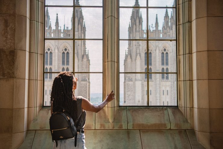 Visitor looking at Cathedral towers during tower climb tour