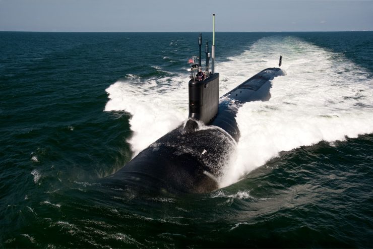 A navy submarine surfaces in the Atlantic ocean