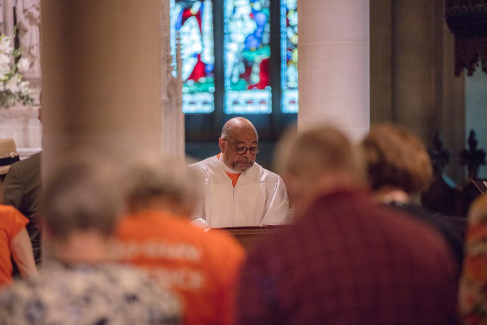A priest leads a service at a Cathedral