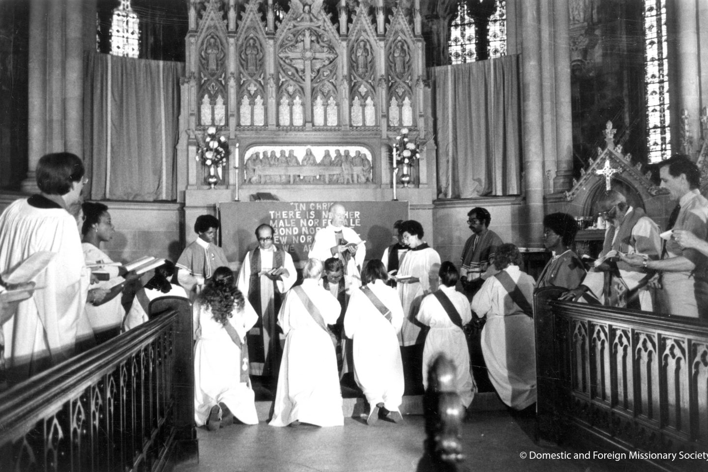 Photo: DFMS; Eleven women kneel at the altar of the Church of the Advocate, Philadelphia, during their ordination to the priesthood on July 29, 1974.