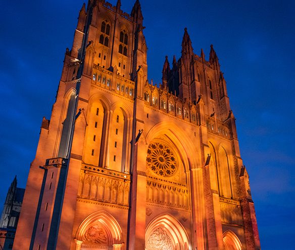Cathedral's West facade lit in orange